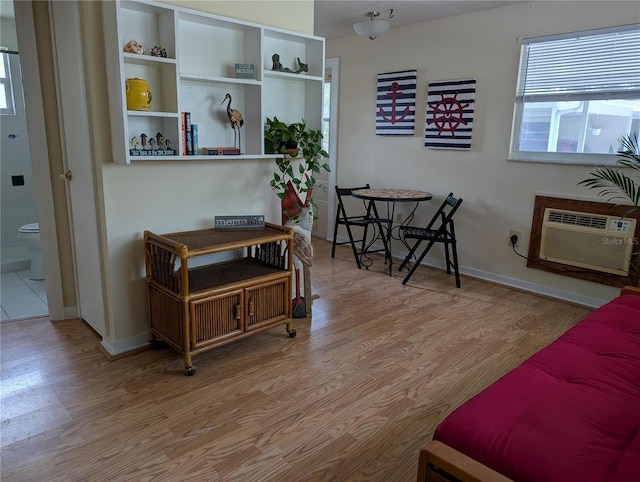 417 Shore Rd, Nokomis, FL 34275 - sitting room with light wood finished floors and a wall mounted air conditioner