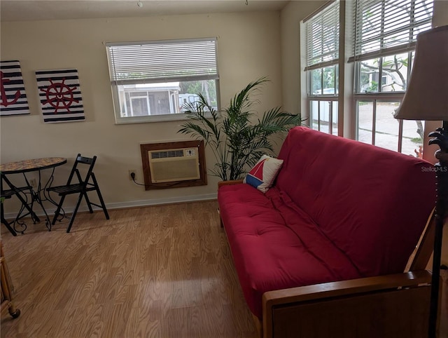 417 Shore Rd, Nokomis, FL 34275 - living area with wood finished floors and a wall mounted air conditioner