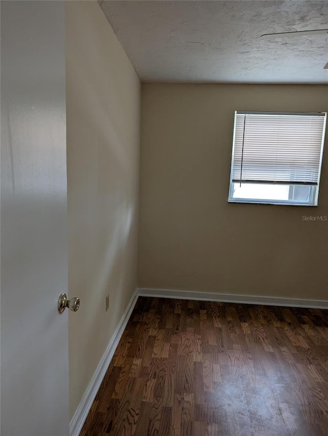 417 Shore Rd, Nokomis, FL 34275 - empty room featuring wood finished floors and baseboards