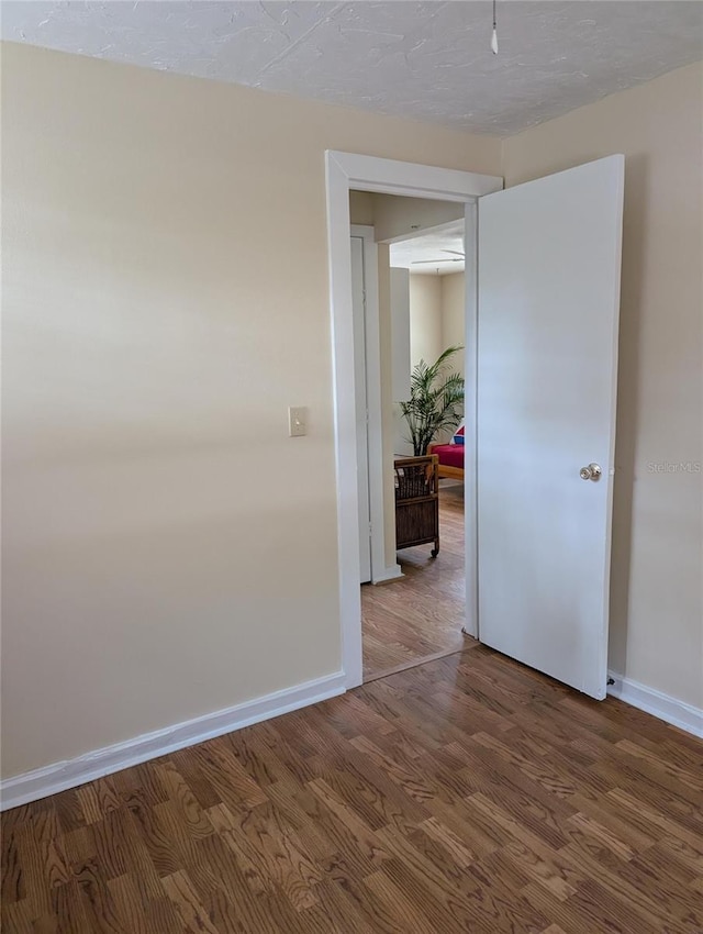 417 Shore Rd, Nokomis, FL 34275 - spare room with baseboards and wood finished floors