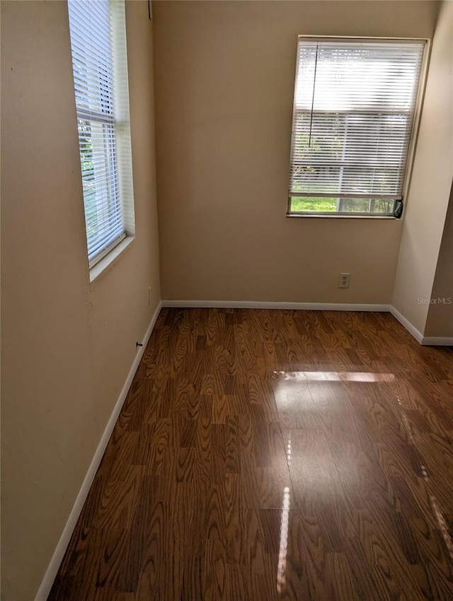 417 Shore Rd, Nokomis, FL 34275 - spare room featuring baseboards and wood finished floors