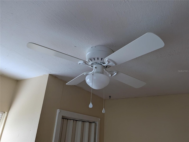 417 Shore Rd, Nokomis, FL 34275 - detailed view of a textured ceiling and a ceiling fan