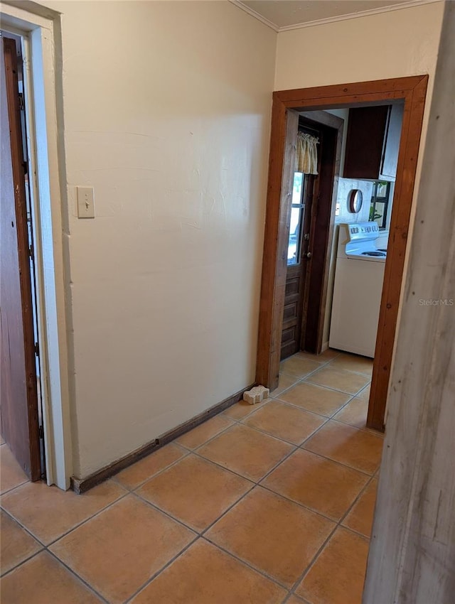 417 Shore Rd, Nokomis, FL 34275 - hall featuring washer / dryer, crown molding, and light tile patterned flooring