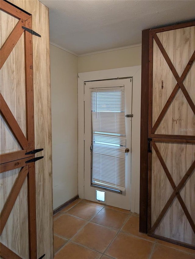 417 Shore Rd, Nokomis, FL 34275 - entryway with ornamental molding and tile patterned floors