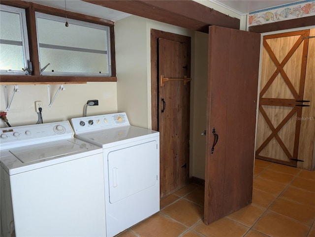 417 Shore Rd, Nokomis, FL 34275 - laundry room with washer and clothes dryer and light tile patterned flooring