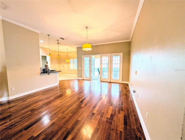 3504 Shorewood Dr, Kissimmee, FL 34746 - unfurnished living room with crown molding and wood finished floors