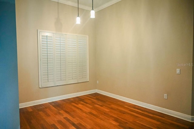 3504 Shorewood Dr, Kissimmee, FL 34746 - spare room with ornamental molding and dark wood finished floors