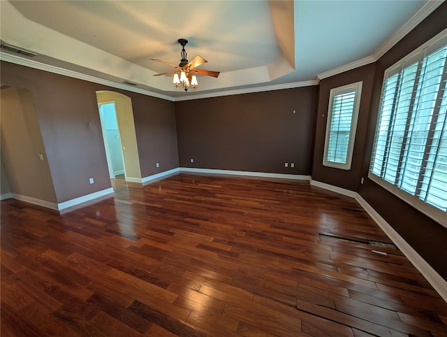 3504 Shorewood Dr, Kissimmee, FL 34746 - empty room featuring arched walkways, a tray ceiling, ceiling fan, hardwood / wood-style floors, and ornamental molding
