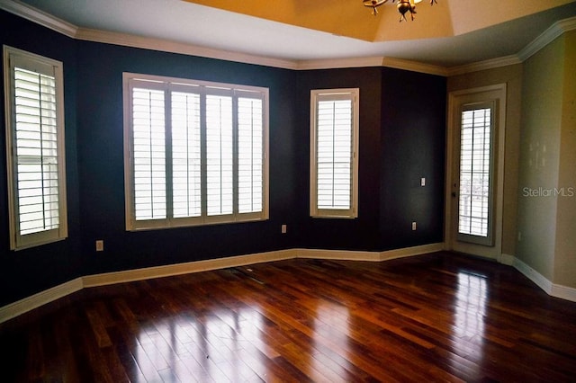 3504 Shorewood Dr, Kissimmee, FL 34746 - unfurnished room with wood finished floors, ornamental molding, and a chandelier