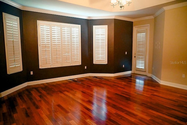 3504 Shorewood Dr, Kissimmee, FL 34746 - spare room with wood finished floors, a chandelier, and ornamental molding