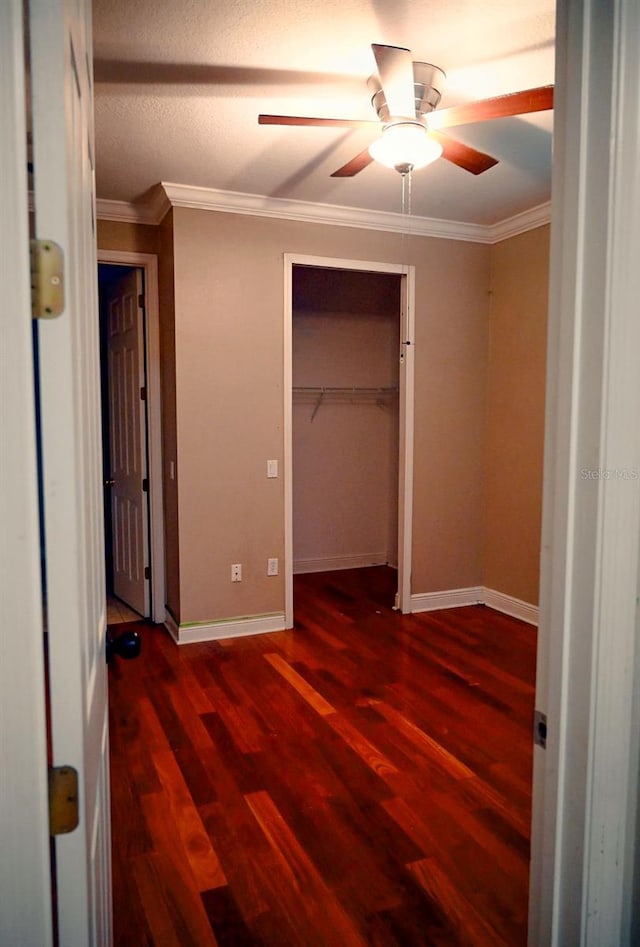 3504 Shorewood Dr, Kissimmee, FL 34746 - unfurnished bedroom featuring wood finished floors, ornamental molding, a closet, and ceiling fan