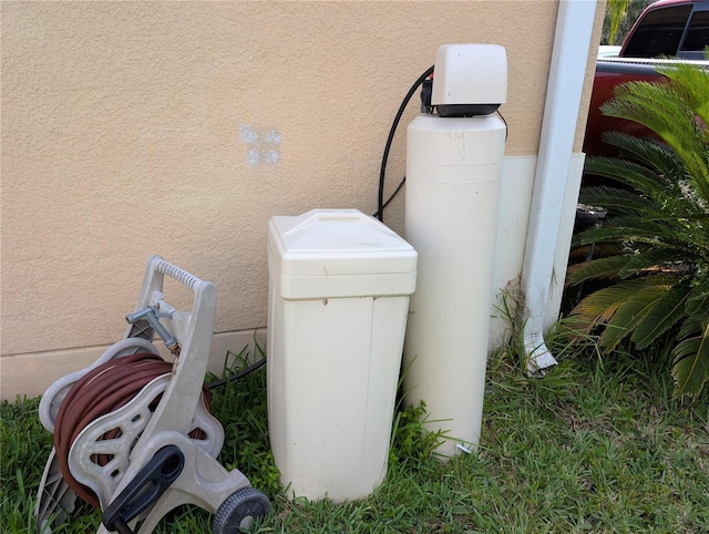 3504 Shorewood Dr, Kissimmee, FL 34746 - exterior view of stucco siding and a water softener system