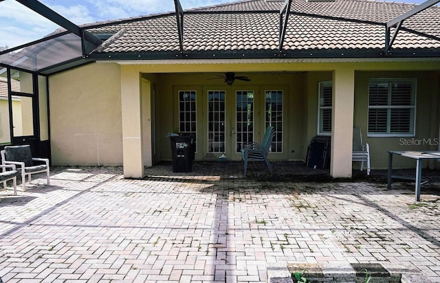 3504 Shorewood Dr, Kissimmee, FL 34746 - view of patio featuring glass enclosure and a ceiling fan