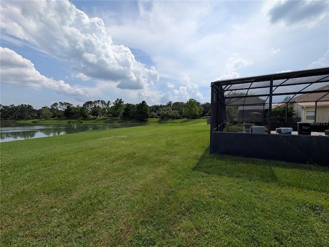 3504 Shorewood Dr, Kissimmee, FL 34746 - view of green lawn featuring a water view and a lanai