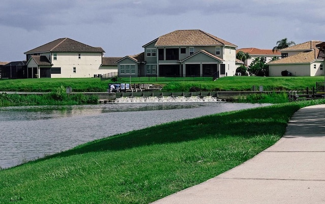 3504 Shorewood Dr, Kissimmee, FL 34746 - view of community with a water view and a lawn