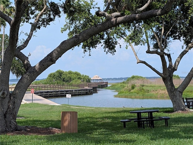 3504 Shorewood Dr, Kissimmee, FL 34746 - view of property's community featuring a water view and a yard