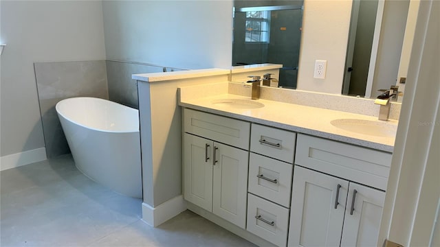 4437 SW 159th Pl, Ocala, FL 34473 - full bathroom with double vanity, a freestanding tub, and a stall shower
