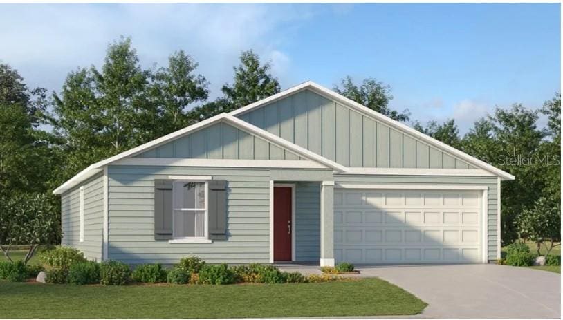 4600 SW 84th Street Rd, Ocala, FL 34476 - view of front facade with board and batten siding, an attached garage, concrete driveway, and a front yard