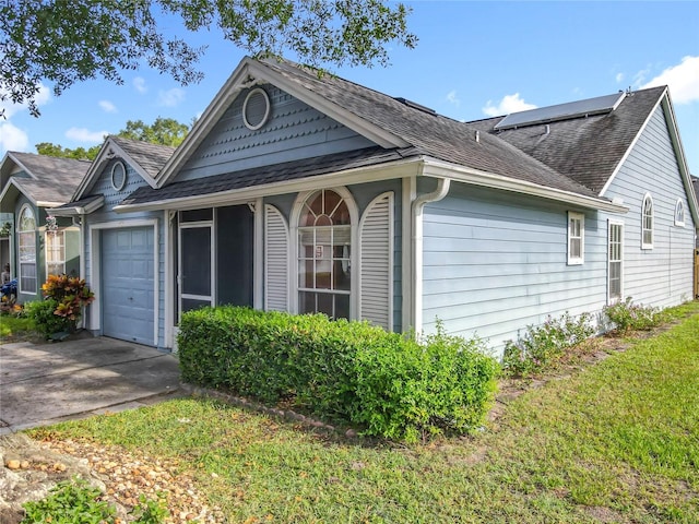 1751 Chatham Cir, Apopka, FL 32703 - view of side of home featuring roof with shingles, an attached garage, and driveway