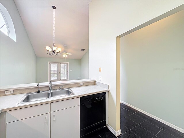 1751 Chatham Cir, Apopka, FL 32703 - kitchen featuring dishwasher, a chandelier, lofted ceiling, dark tile patterned flooring, and white cabinetry