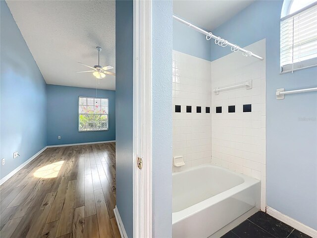 1751 Chatham Cir, Apopka, FL 32703 - full bathroom featuring ceiling fan, shower / washtub combination, and wood finished floors