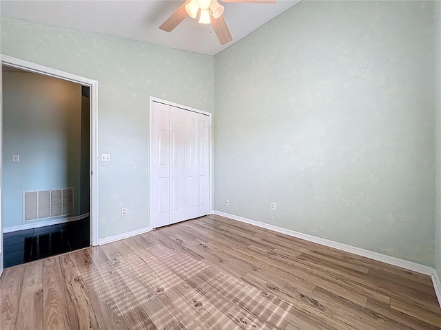 1751 Chatham Cir, Apopka, FL 32703 - unfurnished bedroom with wood finished floors, a closet, ceiling fan, and vaulted ceiling