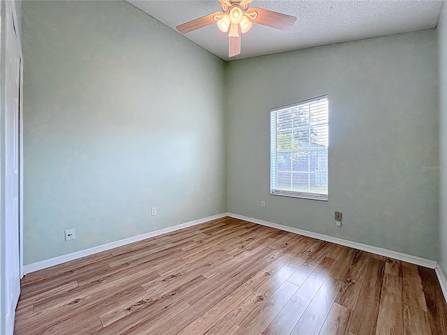 1751 Chatham Cir, Apopka, FL 32703 - spare room with wood finished floors, a ceiling fan, and a textured ceiling