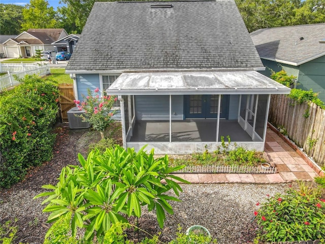 1751 Chatham Cir, Apopka, FL 32703 - back of house featuring a sunroom, french doors, and a fenced backyard