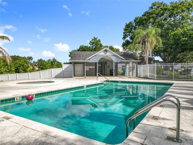 1751 Chatham Cir, Apopka, FL 32703 - community pool with a hot tub and a patio