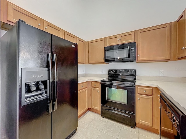 2092 Switch Grass Cir, Ocoee, FL 34761 - kitchen with black appliances, light tile patterned flooring, and light countertops