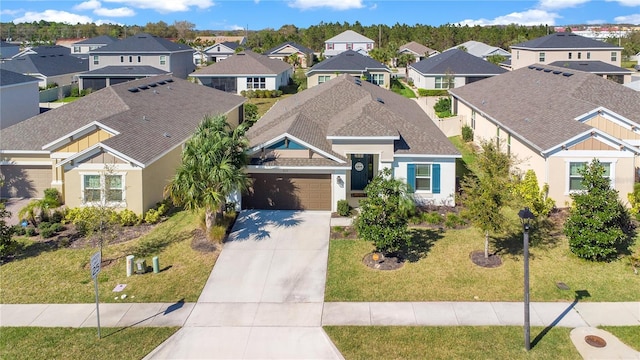 913 Sabal Breeze Ln, Apopka, FL 32703 - view of front of property with a residential view, driveway, a garage, and a front lawn