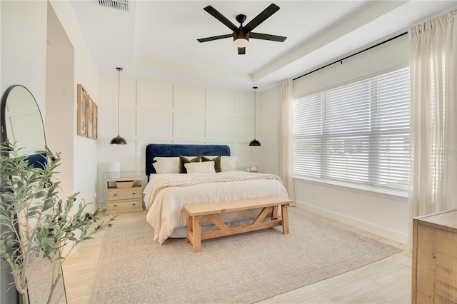 913 Sabal Breeze Ln, Apopka, FL 32703 - bedroom featuring a tray ceiling and a ceiling fan