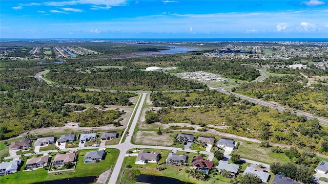 142 Broadmoor Ln, Rotonda West, FL 33947 - aerial view of property and surrounding area with nearby suburban area and a nearby body of water