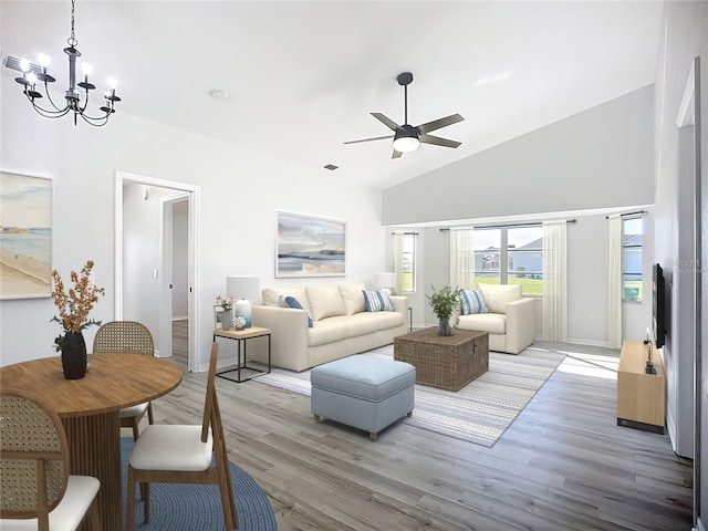 142 Broadmoor Ln, Rotonda West, FL 33947 - living room with a chandelier, light wood-style flooring, a ceiling fan, and vaulted ceiling