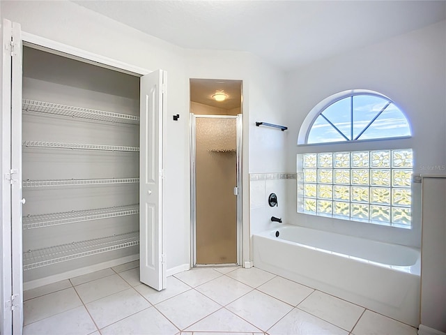 142 Broadmoor Ln, Rotonda West, FL 33947 - full bath with tile patterned flooring, a garden tub, and a stall shower
