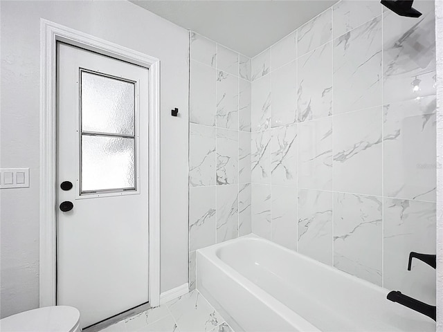 142 Broadmoor Ln, Rotonda West, FL 33947 - bathroom with marble finish floors and bathing tub / shower combination