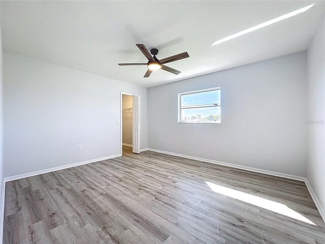 142 Broadmoor Ln, Rotonda West, FL 33947 - spare room featuring wood finished floors and a ceiling fan