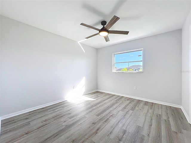 142 Broadmoor Ln, Rotonda West, FL 33947 - spare room with wood finished floors and a ceiling fan