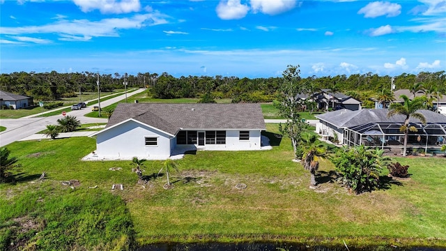142 Broadmoor Ln, Rotonda West, FL 33947 - view of subject property featuring a tree filled landscape