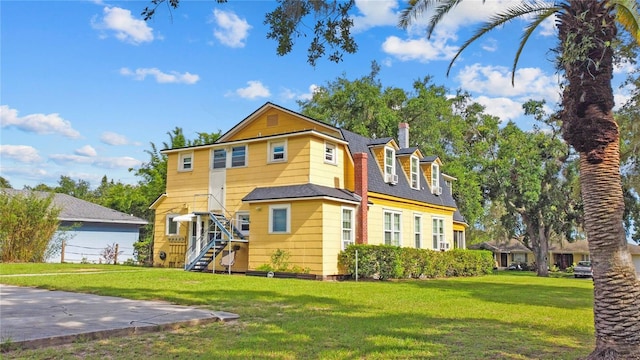 430 W Minnehaha Ave, Clermont, FL 34711 - view of front of property with a front lawn, stairway, and a chimney