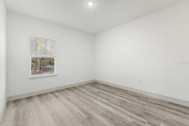 2451 W Menores Dr, Citrus Springs, FL 34434 - unfurnished room with light wood-style flooring and recessed lighting