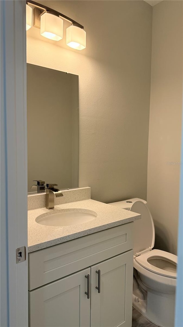 2451 W Menores Dr, Citrus Springs, FL 34434 - bathroom featuring vanity and toilet