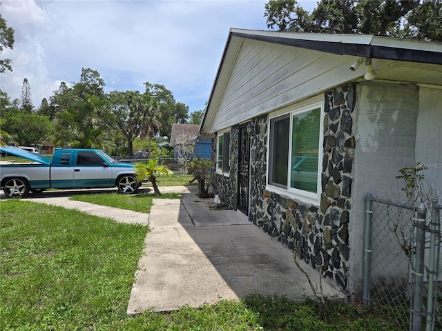 2308 18th St E, Bradenton, FL 34208 - view of side of home featuring stone siding