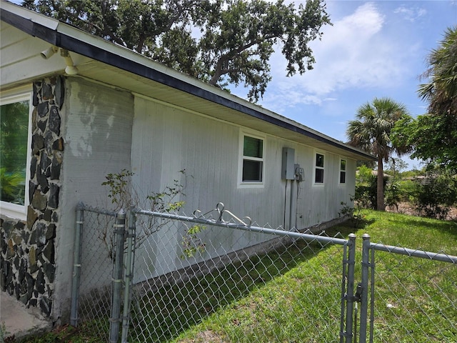 2308 18th St E, Bradenton, FL 34208 - view of side of home featuring a gate
