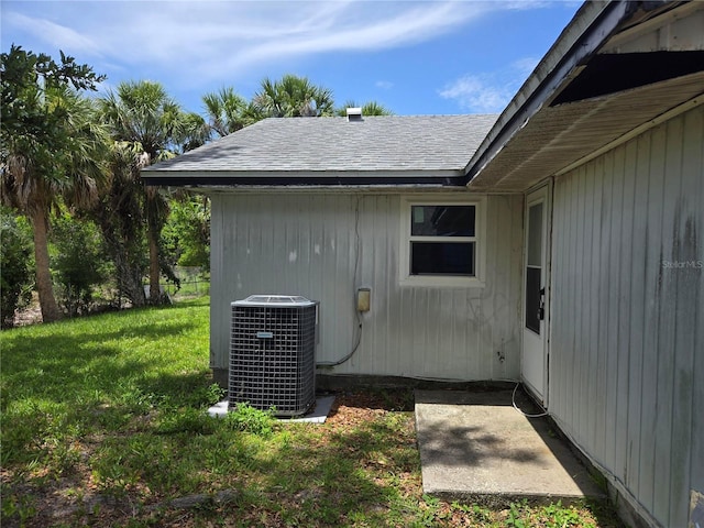 2308 18th St E, Bradenton, FL 34208 - view of home's exterior featuring a lawn and roof with shingles