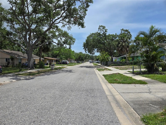 2308 18th St E, Bradenton, FL 34208 - view of asphalt road with sidewalks, a residential view, and curbs