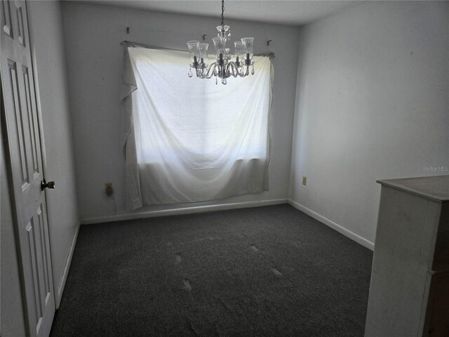 2308 18th St E, Bradenton, FL 34208 - unfurnished dining area with carpet floors and a chandelier