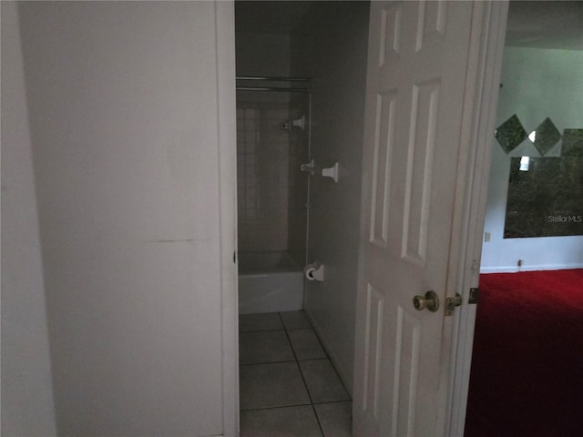 2308 18th St E, Bradenton, FL 34208 - bathroom featuring tile patterned flooring and bathing tub / shower combination
