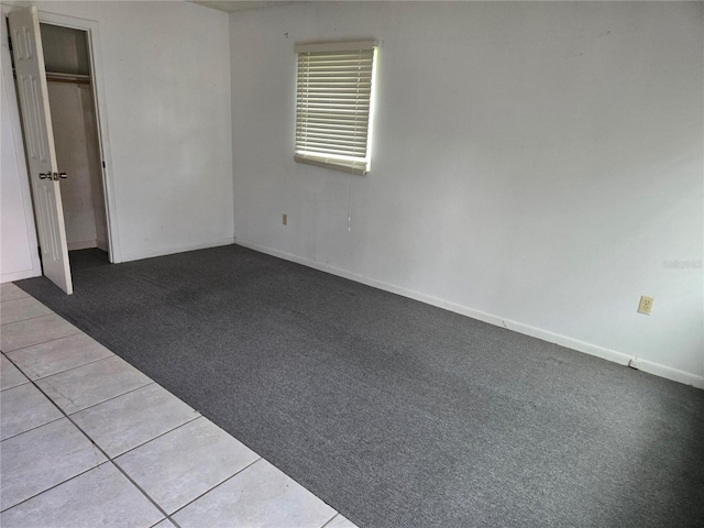 2308 18th St E, Bradenton, FL 34208 - unfurnished bedroom with carpet and tile patterned floors