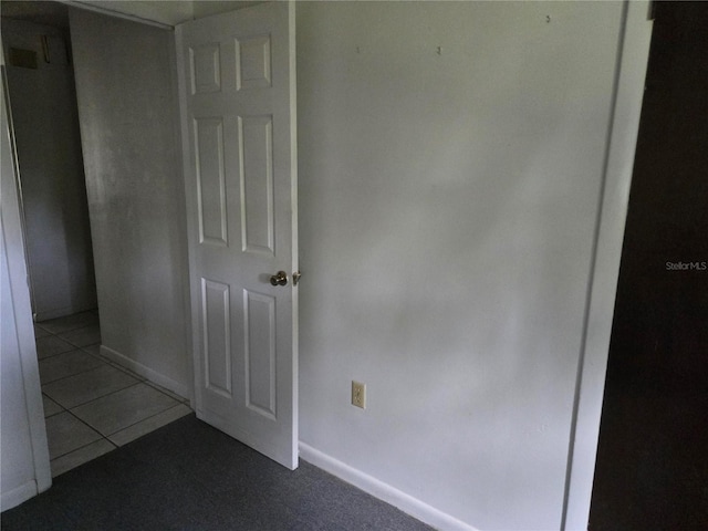 2308 18th St E, Bradenton, FL 34208 - empty room with dark tile patterned floors and baseboards